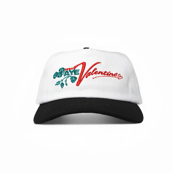 White cap with black visor featuring colorful text and graphics on a white background