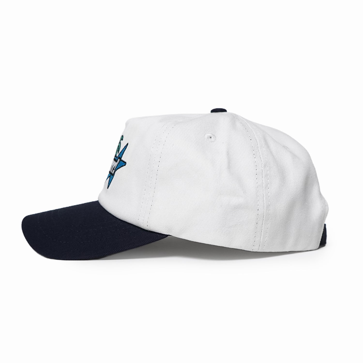 White cap with navy bill and embroidered logo on a white background