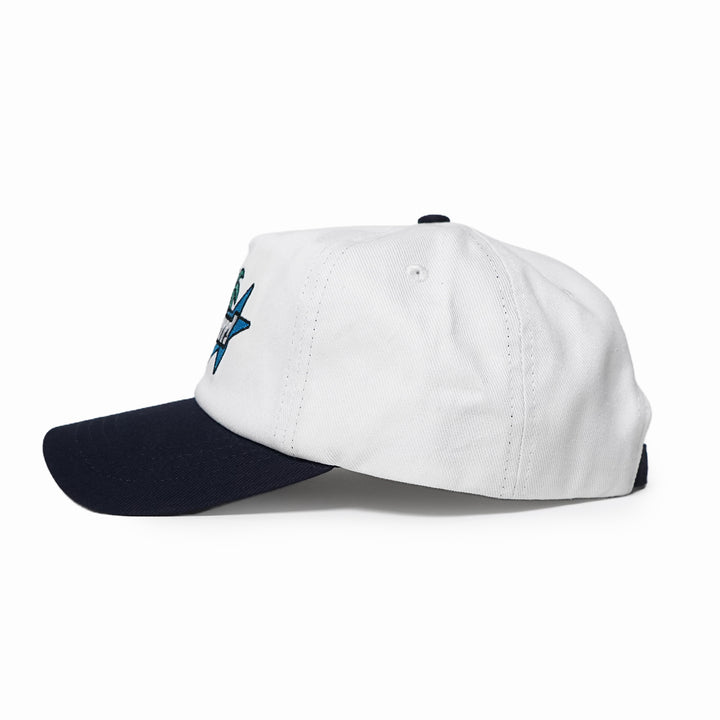 White cap with navy bill and embroidered logo on a white background