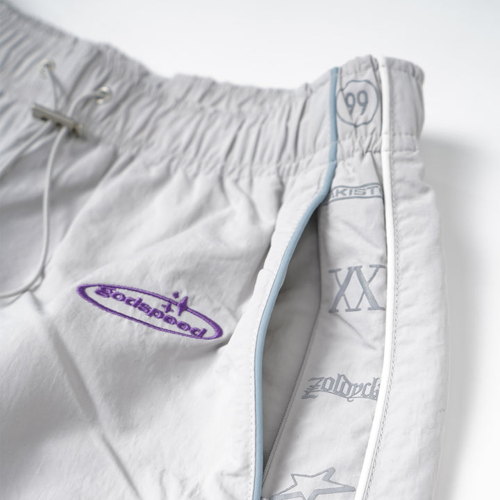 White shorts with branding on a white background