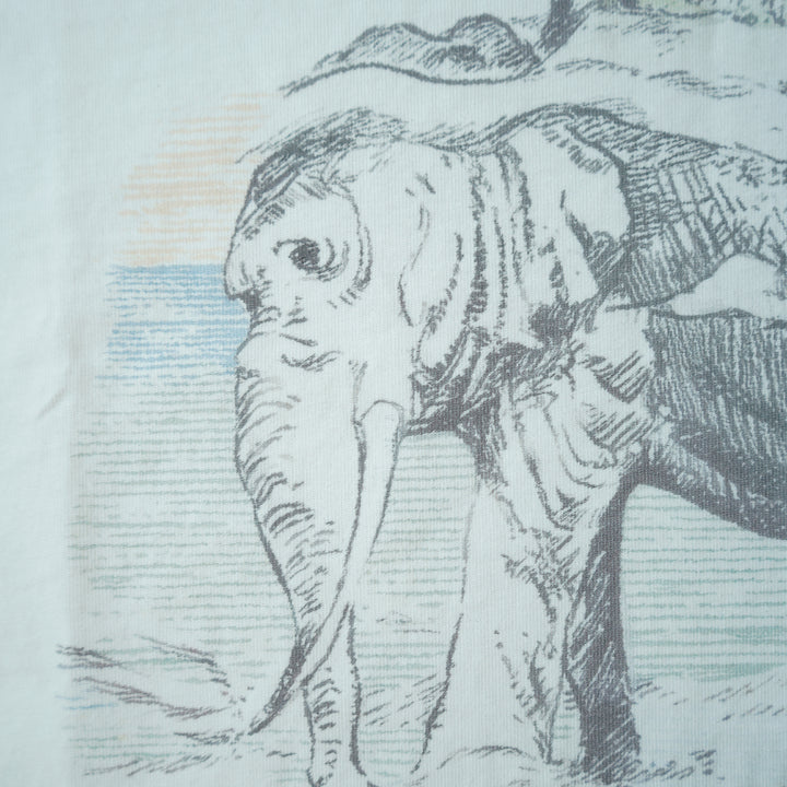 Illustration of an elephant with a person on its back, set against a light blue background.