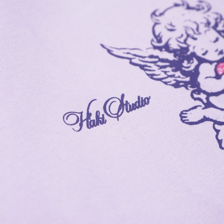 Cute cartoon character with wings and a bow on a light purple background, featuring the brand 'Hello Choucou'.