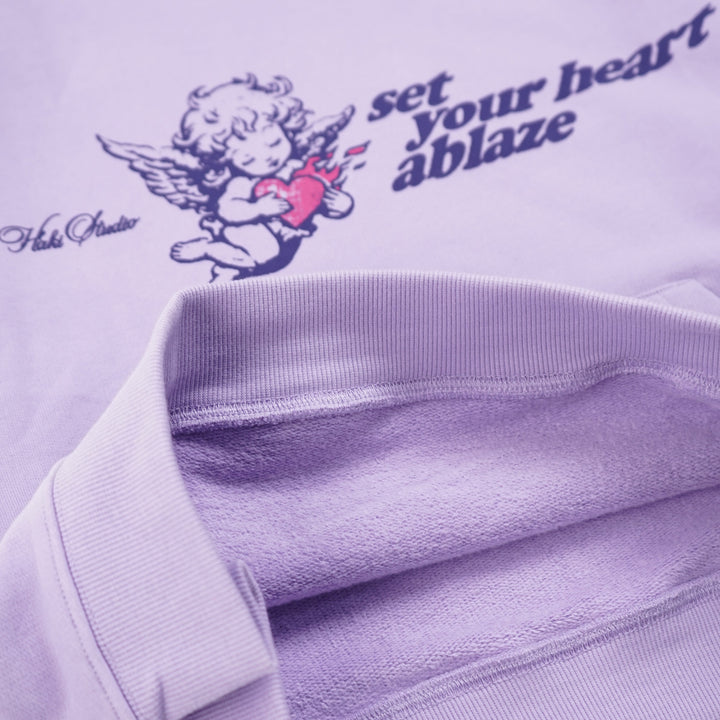 Purple hoodie with graphic design and text on a white background