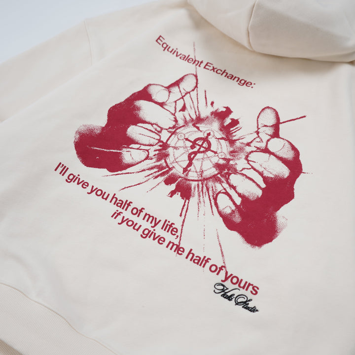 Beige hoodie with red graphic and text on a white background