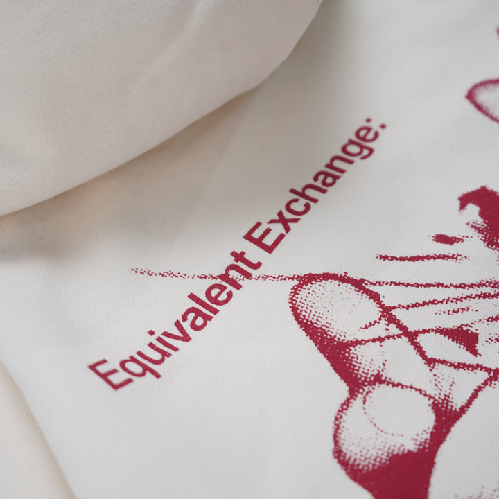 White shirt with red graphic and text 'Equivalent Exchange' on a white background