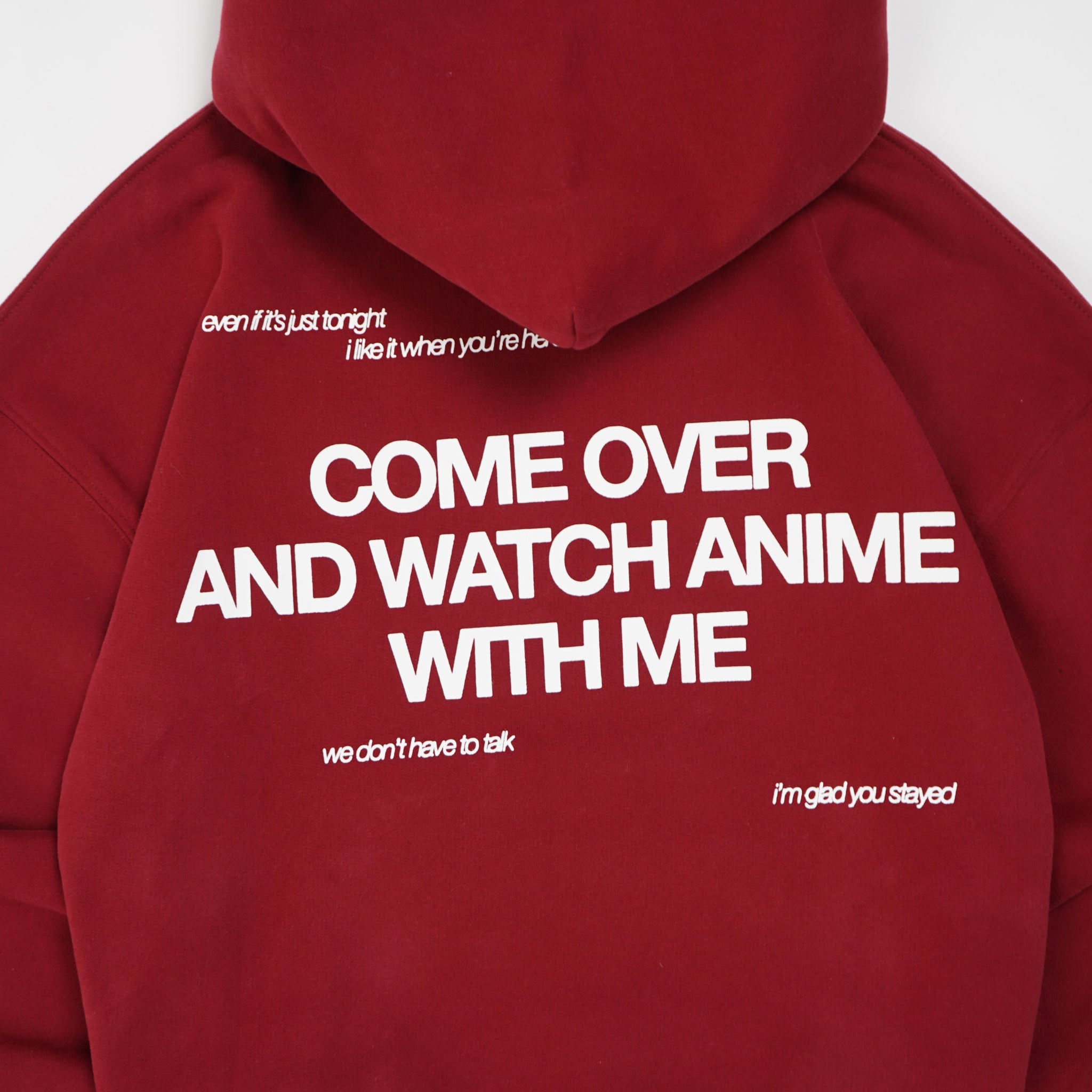 Red hoodie with white text on a white background