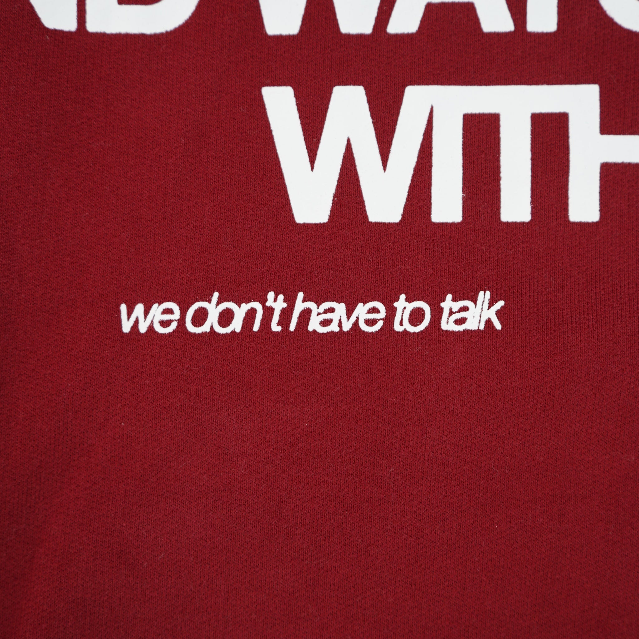 Red fabric with white text on a red background