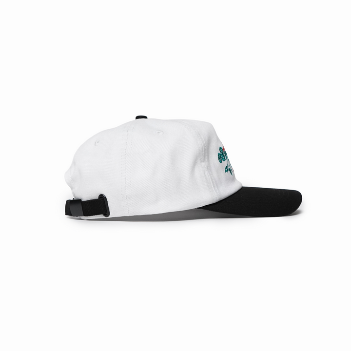 White and black cap with a small logo on a white background